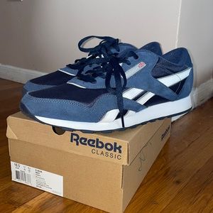 Very great condition used Reebok Classic; navy blue with nylon material. 10.5